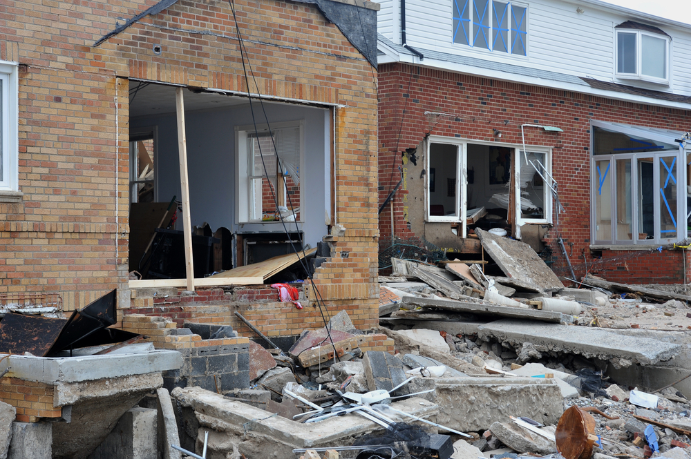 Storm and wind damaged house representing insurance claim in Manhattan